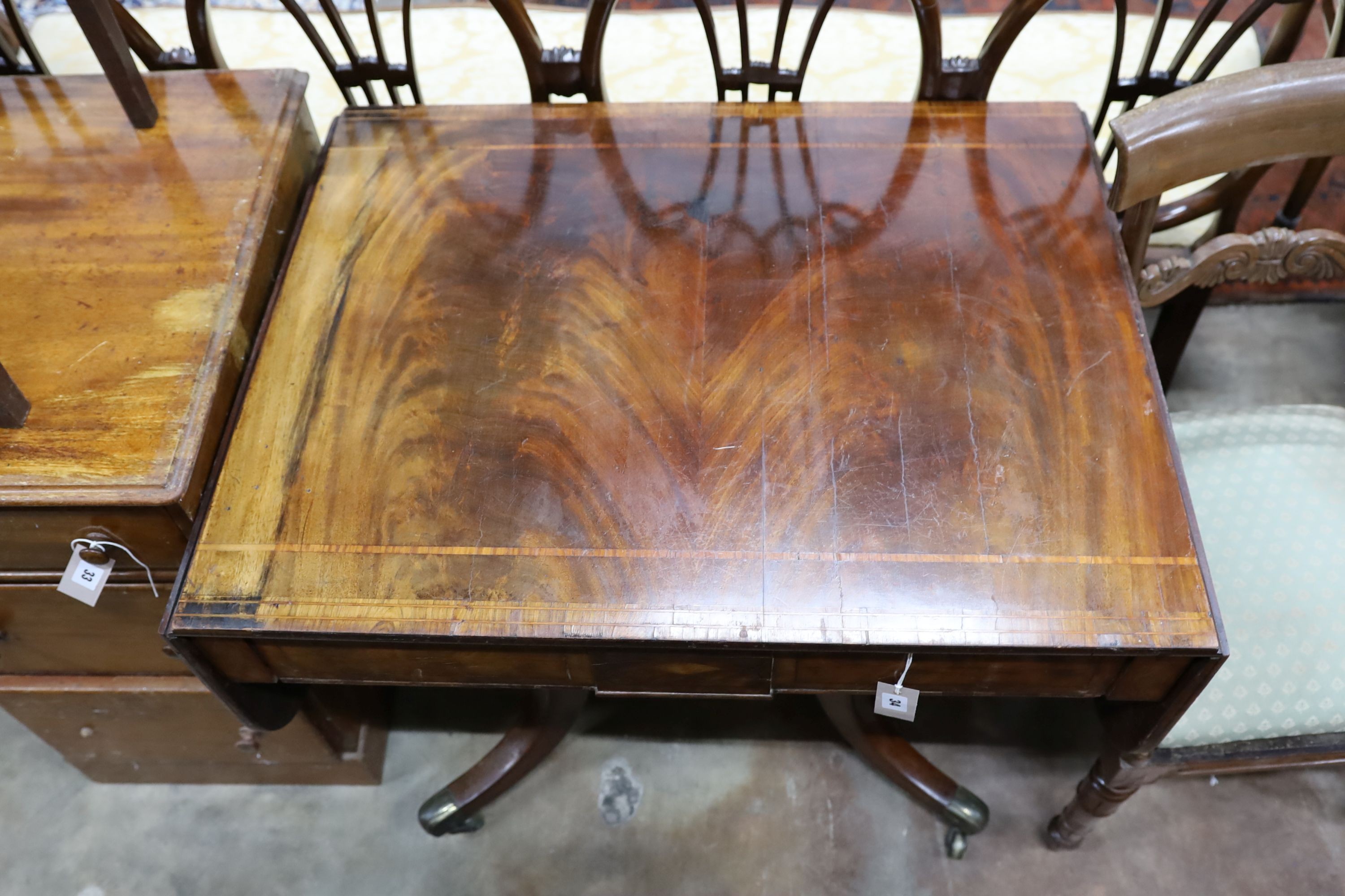 A Regency tulip banded mahogany sofa table, width 87cm, height 70cm